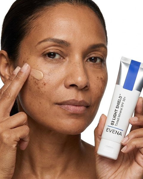 The tinted sunscreen blending into brown skin